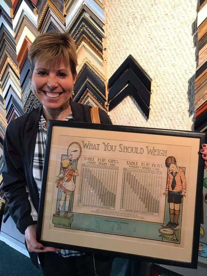A happy Magnolia House customer with framed work