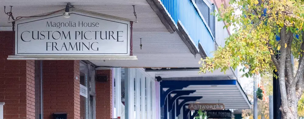 The Magnolia House shop sign on South Main Street