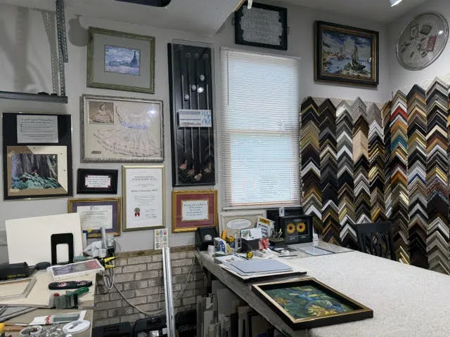 Design counter with finished pieces on the wall