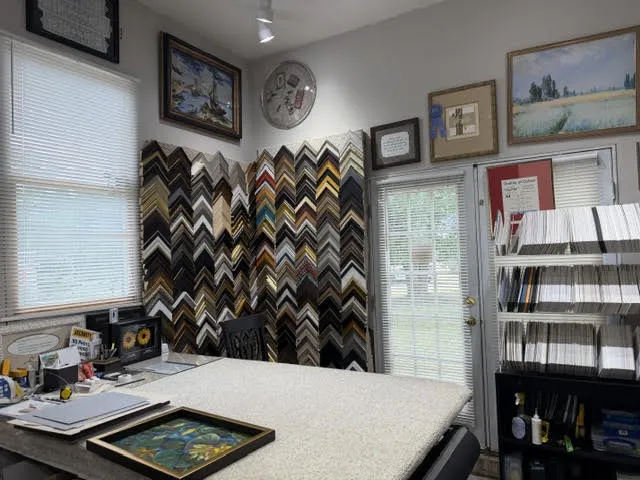 Work table with a framed painting in progress
